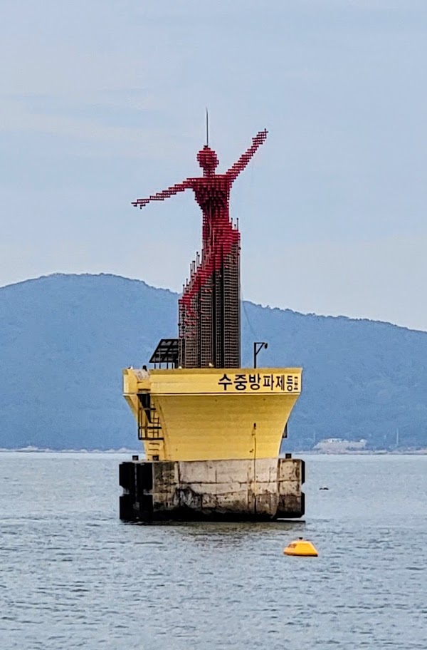Statue leaping man