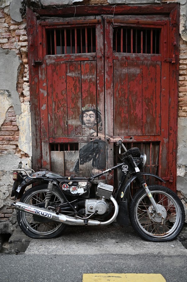 Penang Street Art - Boy on Motorbike by Ernest Zacharevic