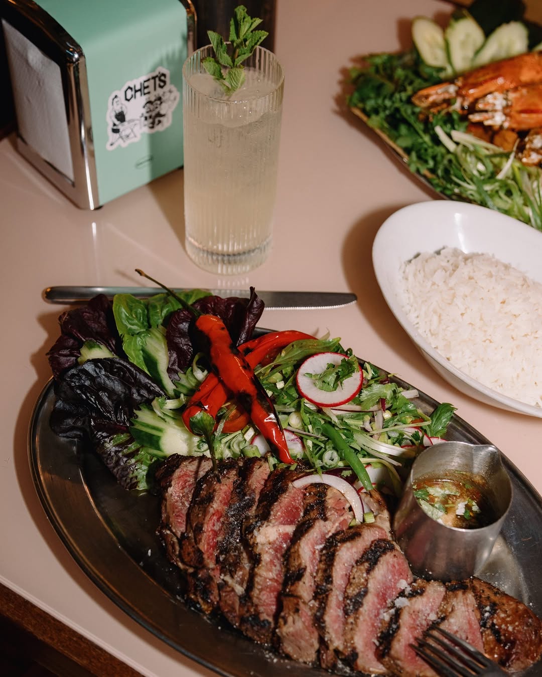 Chet's Dallas Serves Charred Ribeye With Spicy Dipping Sauce