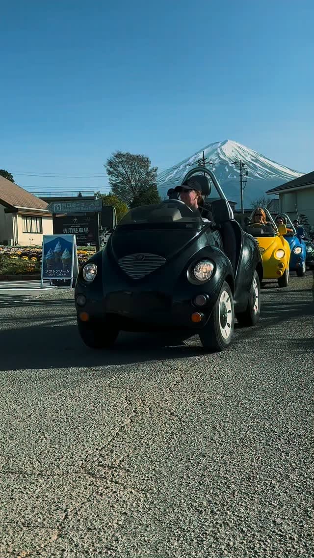 Mini-Cars Drive Past Mount Fuji and Soft Cream Stand