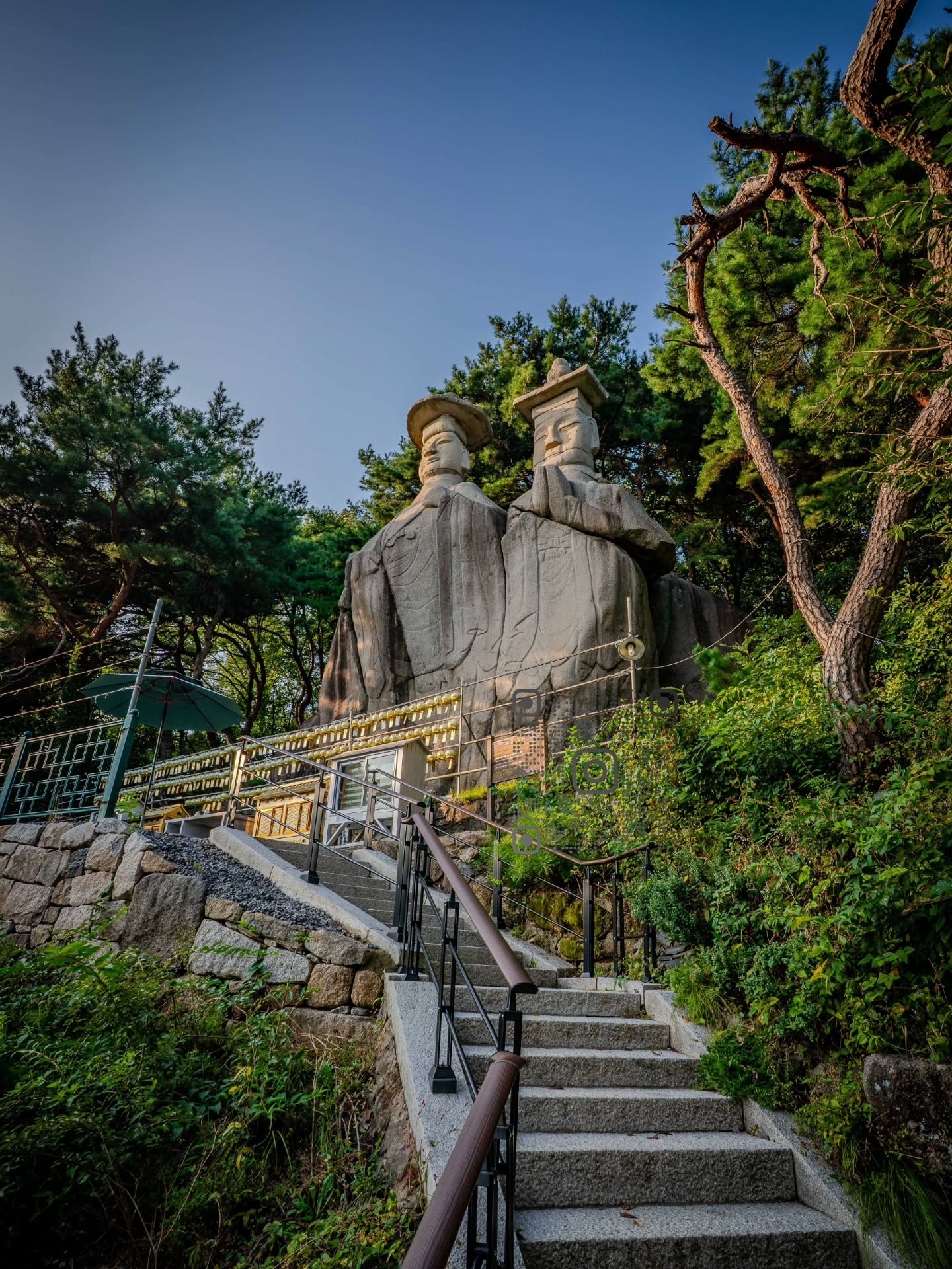 Two Grotto Buddha Sculptures