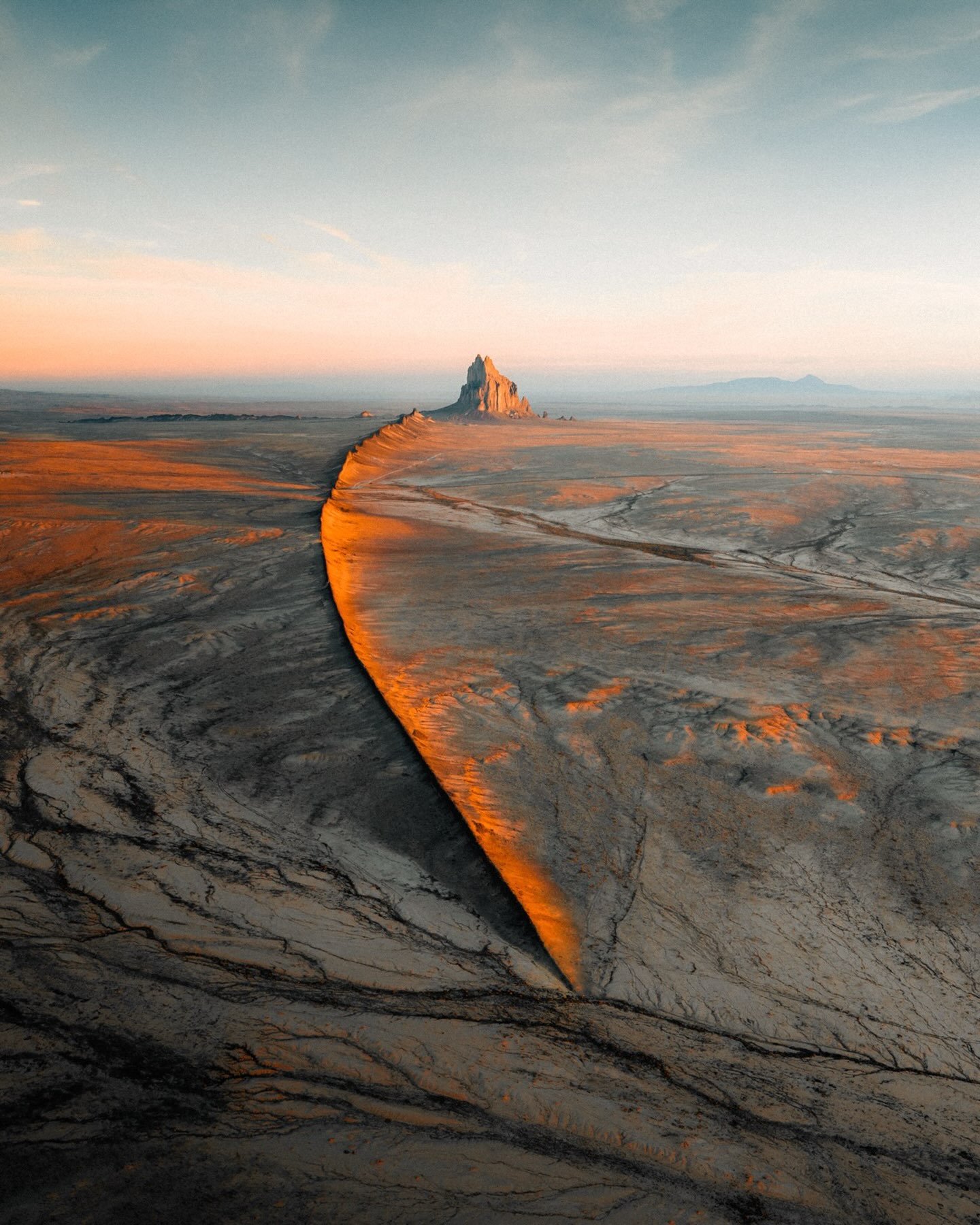 Monumental Rock Formation In Desolate Landscape