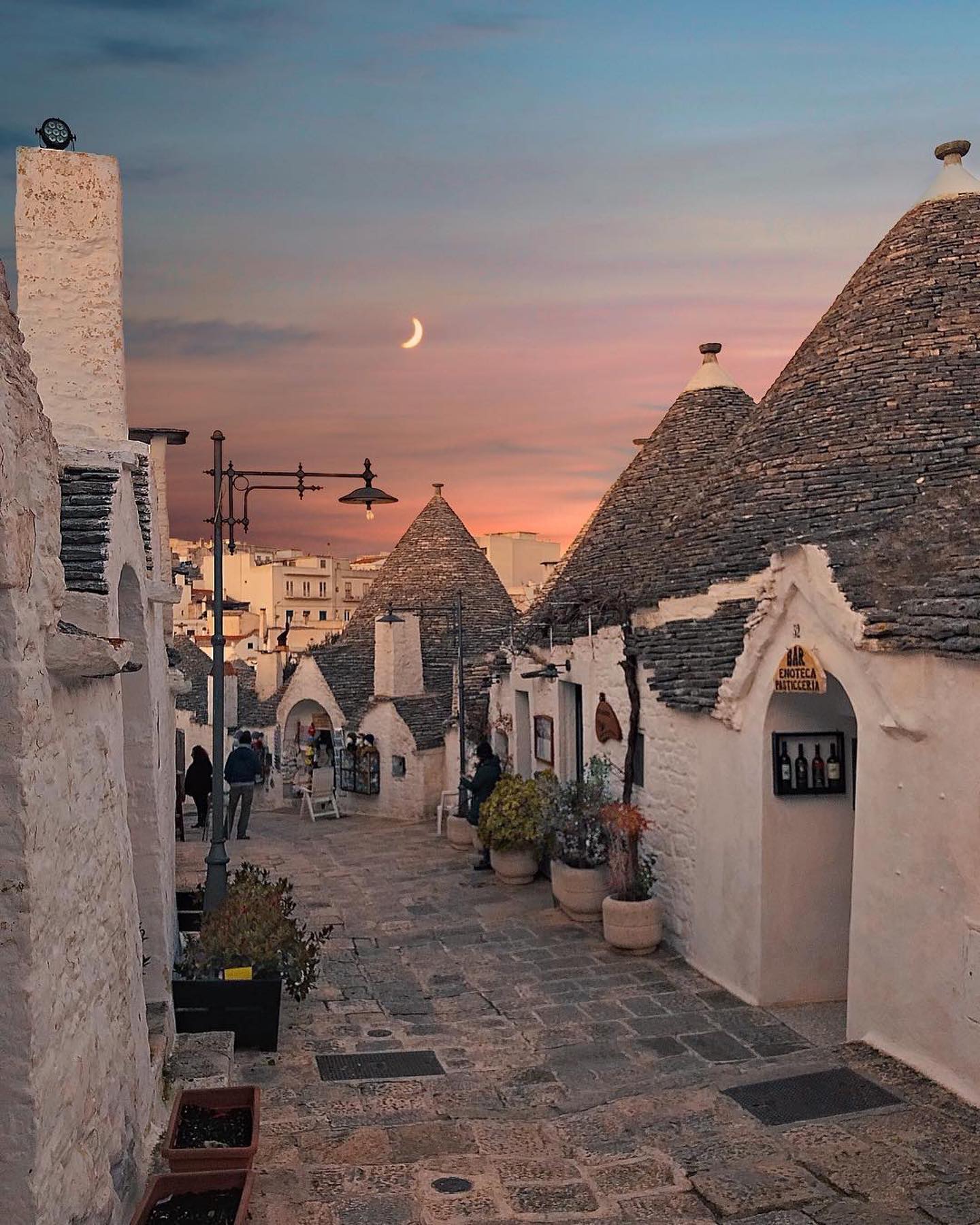 Alberobello's Enchanting Trulli Houses At Sunset