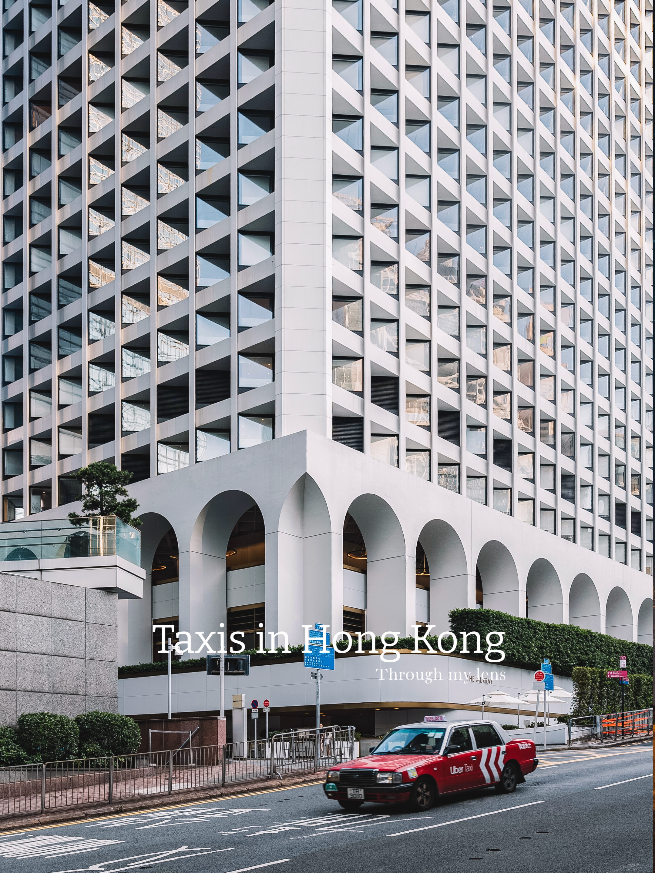 Hong Kong Taxis Among Urban Landscapes