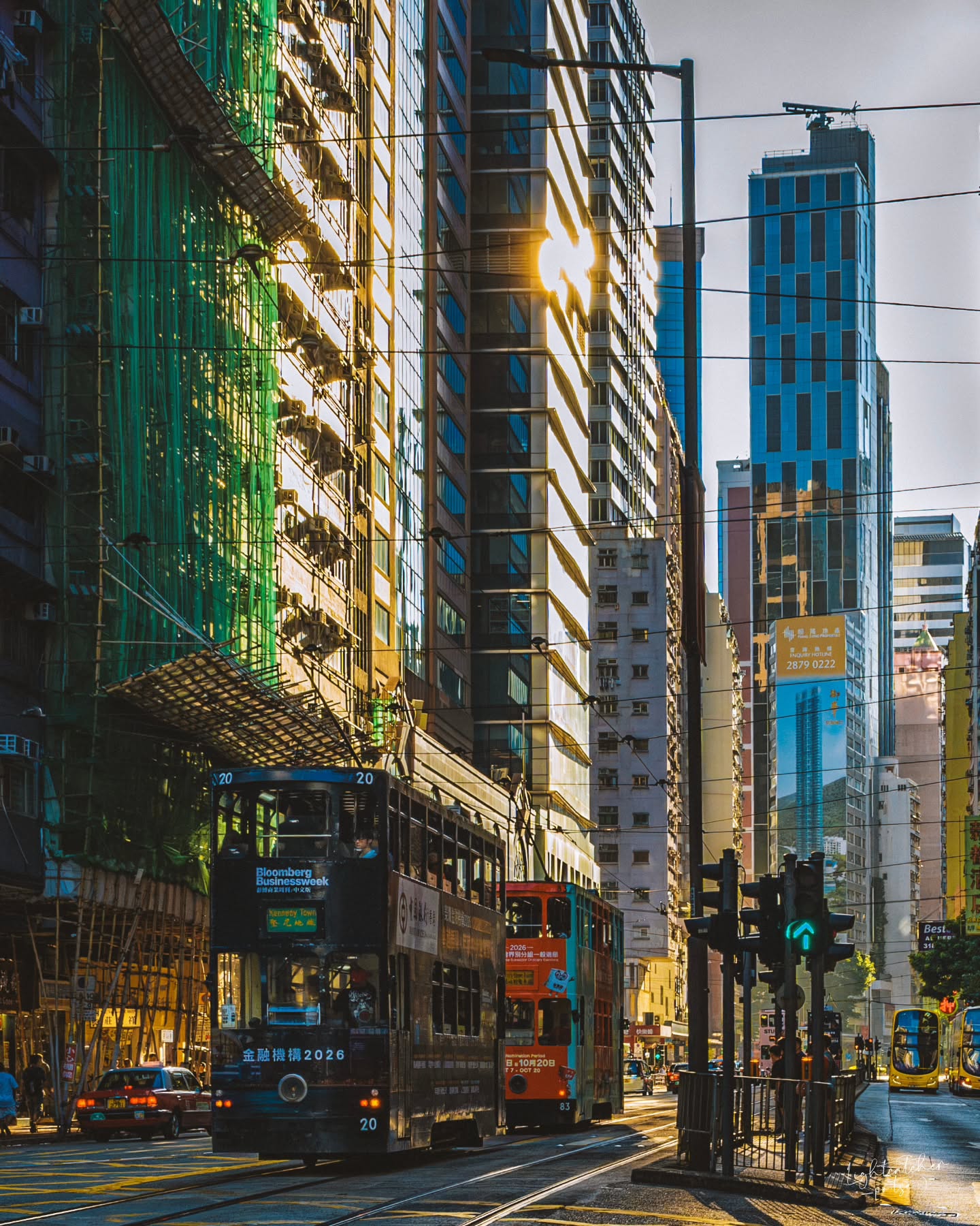 Hong Kong Trams Amidst Golden Hour Cityscapes