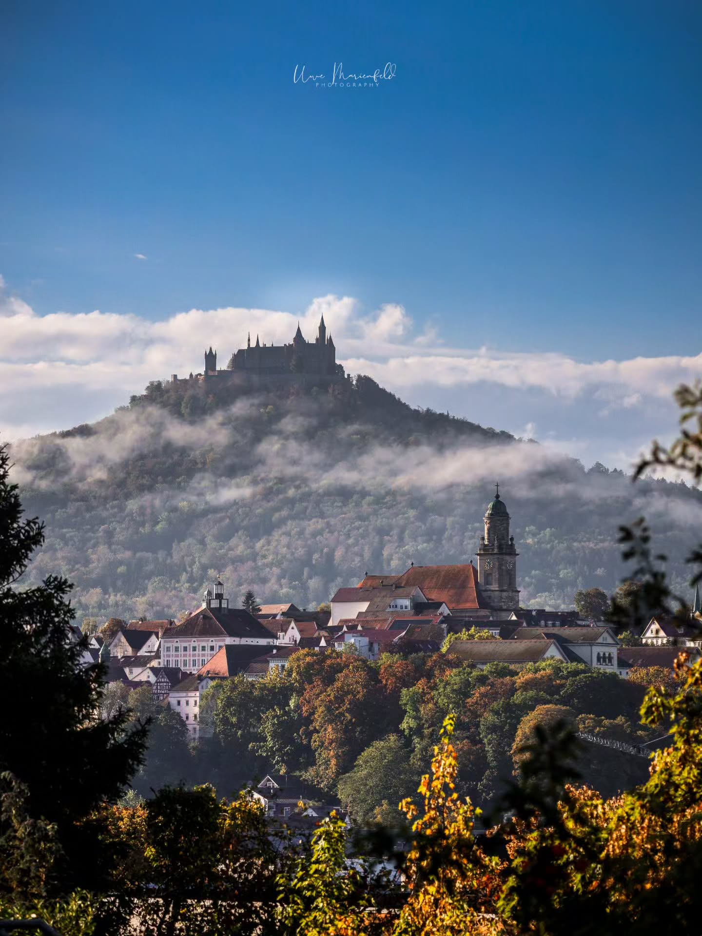 Hohenzollern Castle Amidst Fog and Autumn Colors