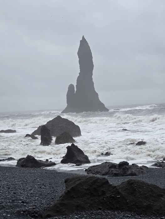 Dramatic Black Pebble Beach With Sea Stack
