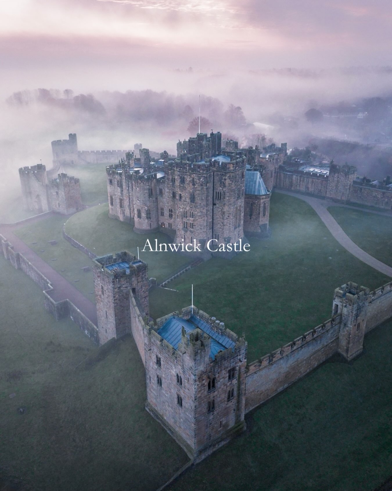 Misty Sunrise Over Historic Alnwick Castle