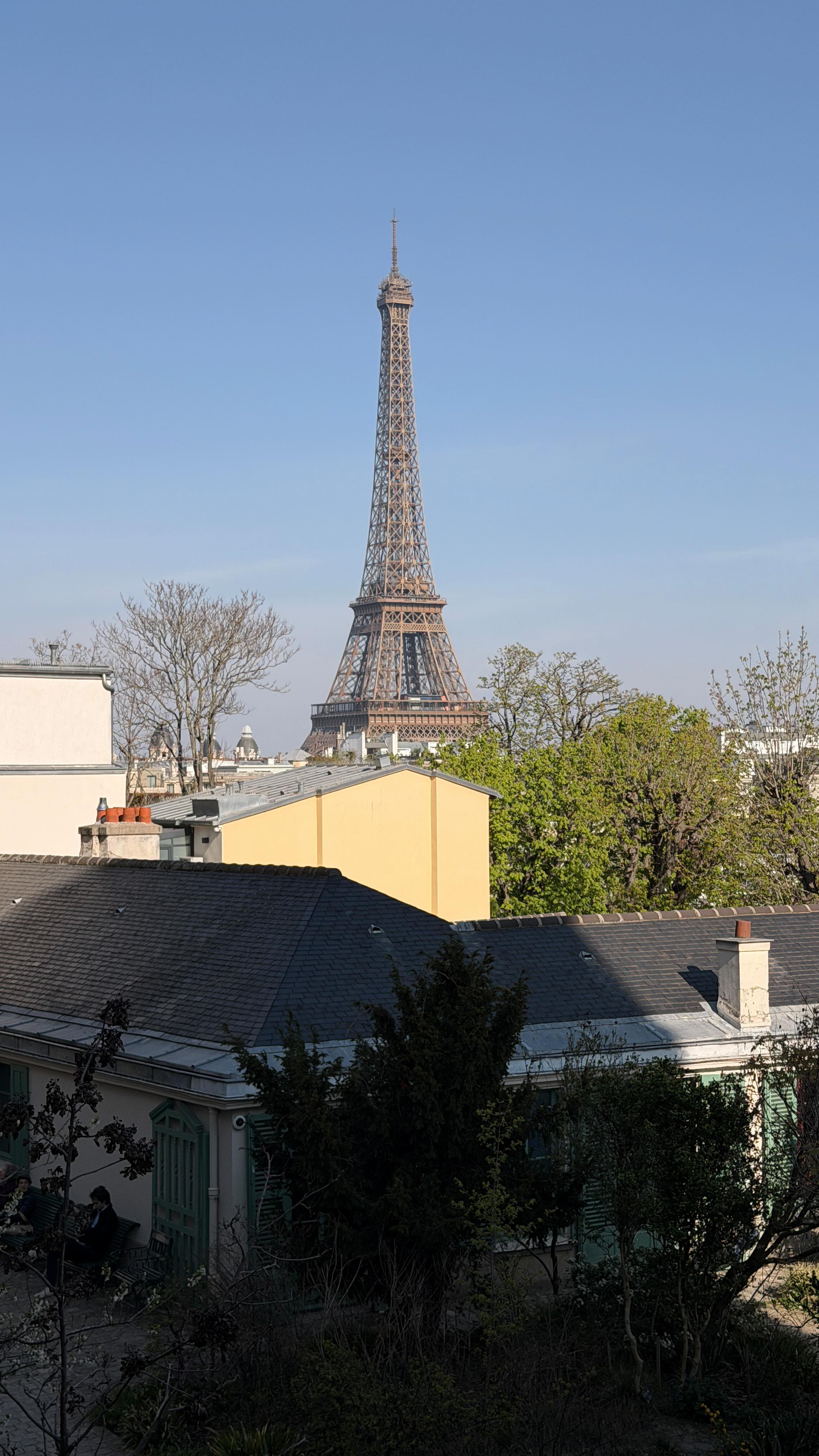 Parisian Cafe With Eiffel Tower View And Secret Garden