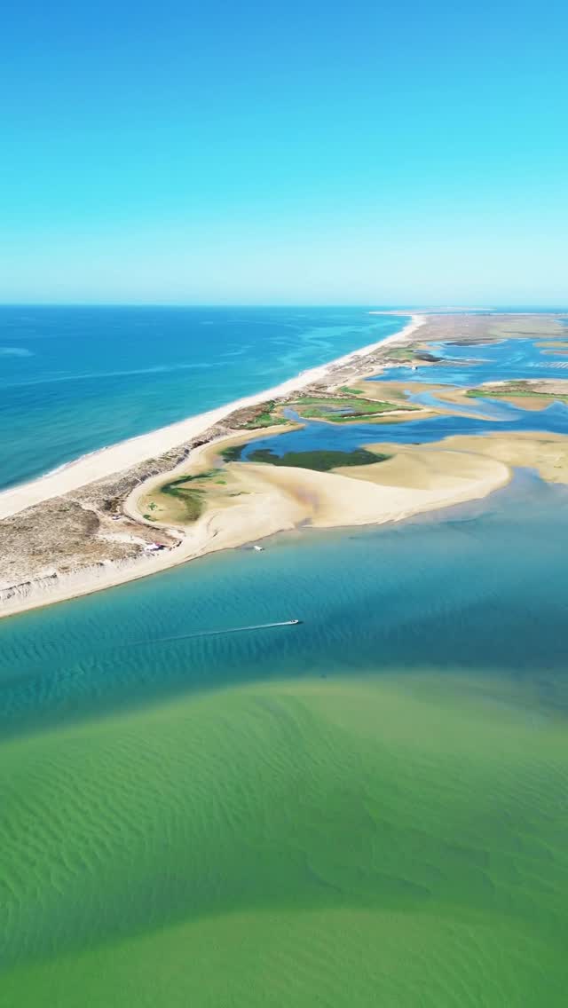 Calm Waters Of Fuseta Beach In Portugal