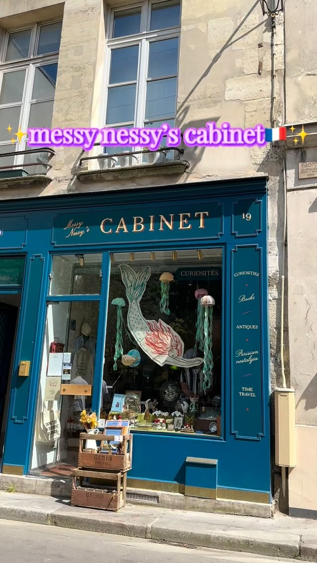 Whimsical Parisian Shop Filled With Antiques And Books