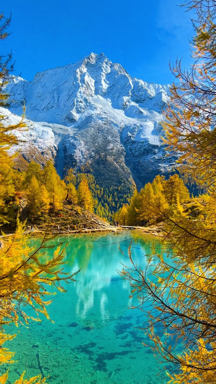 Stunning Blue Lake Amidst Swiss Mountains