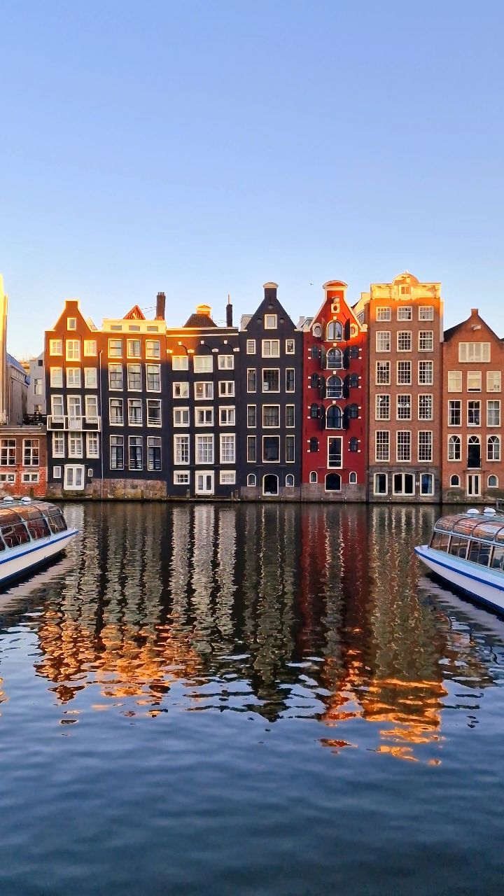 Amsterdam's Damrak At Sunset
