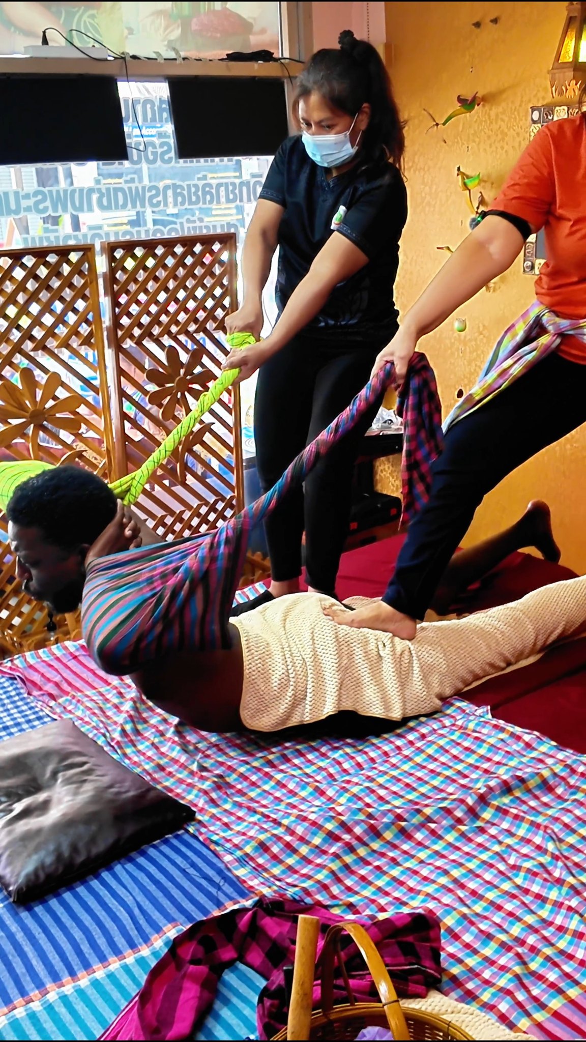 Thai Massage Session Involves Deep Stretching