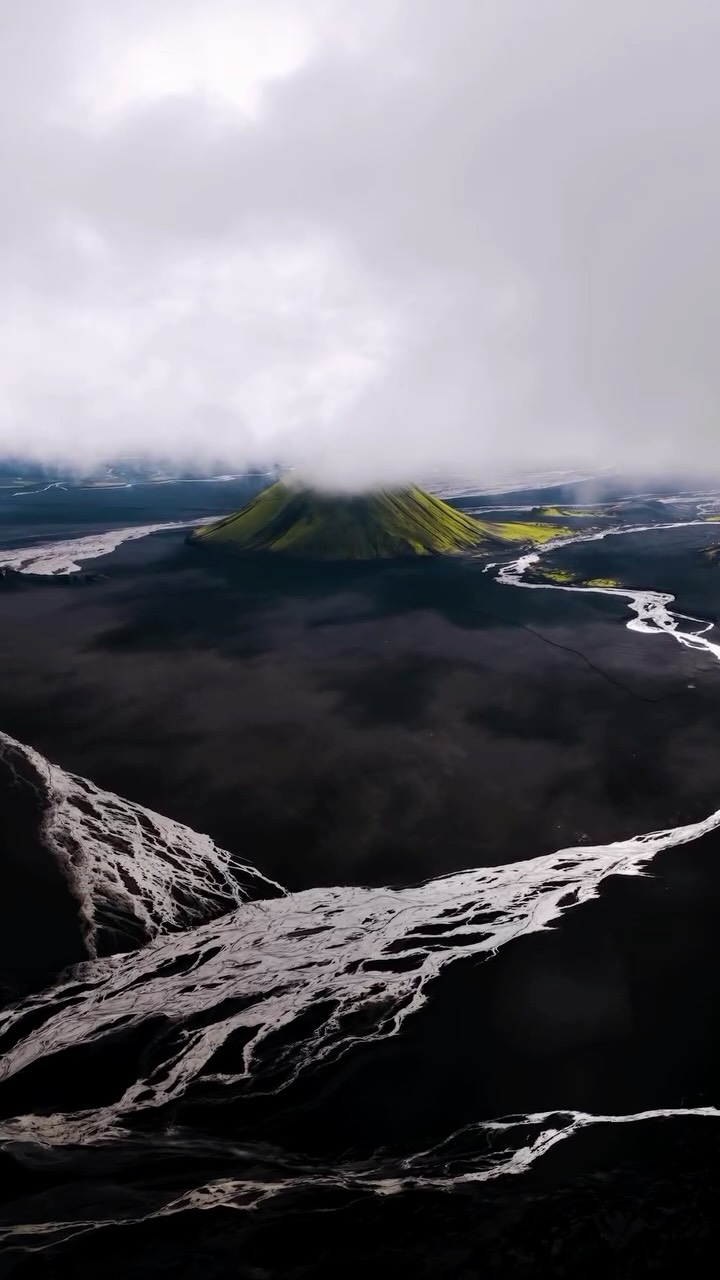 Dramatic Icelandic Mountain Covered in Neon Moss