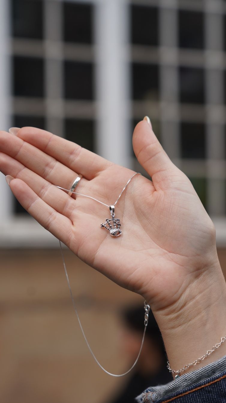 Scottish Souvenir Jewelry Showcases Bagpipe Designs