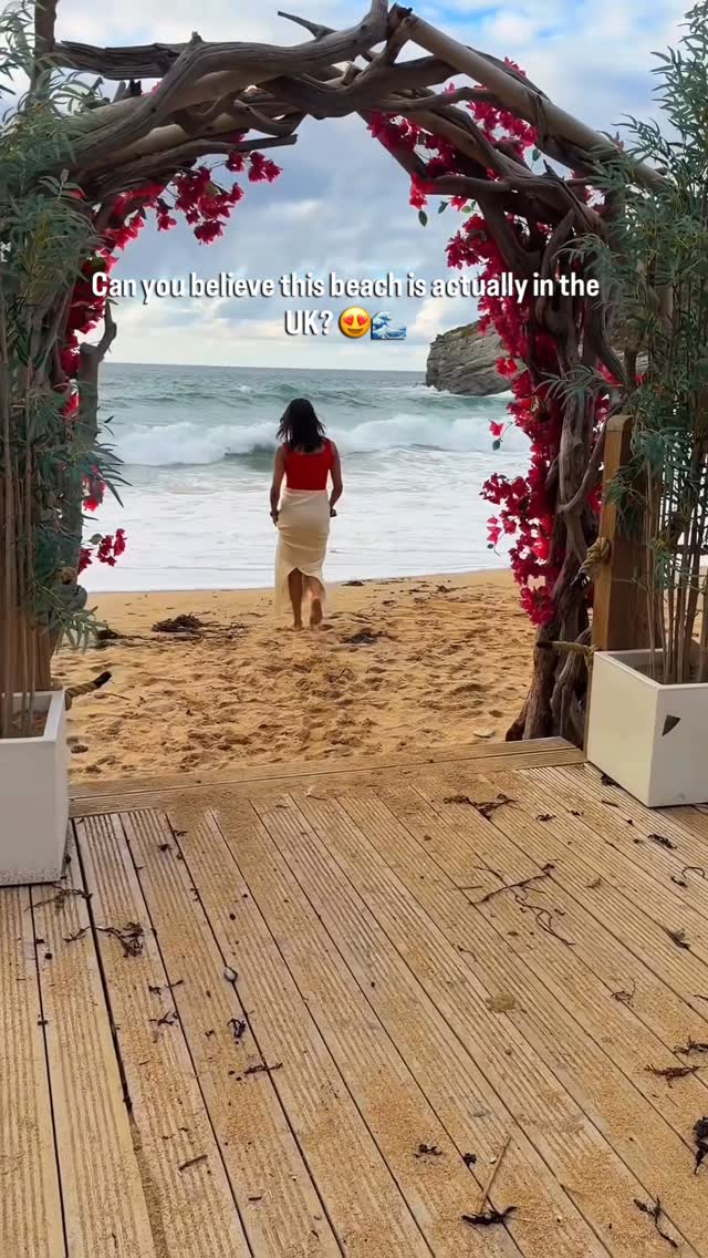 Secret Beach With Golden Sand And Dramatic Cliffs