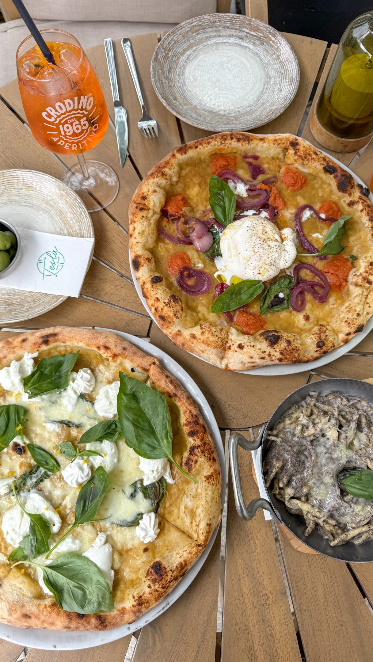 Enjoying Pizza and Drinks at Tesla Pizza