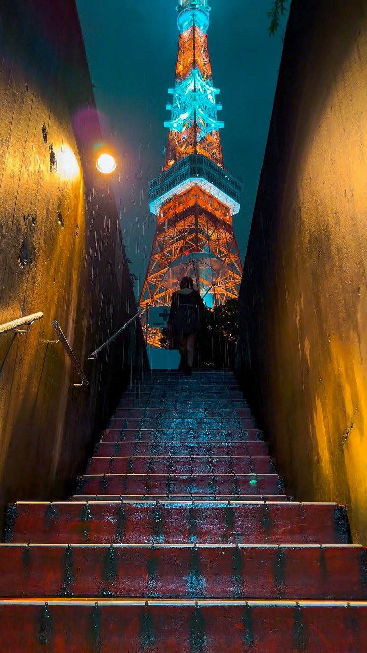 Tokyo Tower Aglow in Nighttime Rain