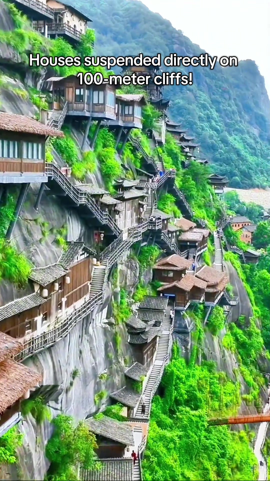 Mystical Wangxian Valley's Cliffside Homes Lit by Lanterns