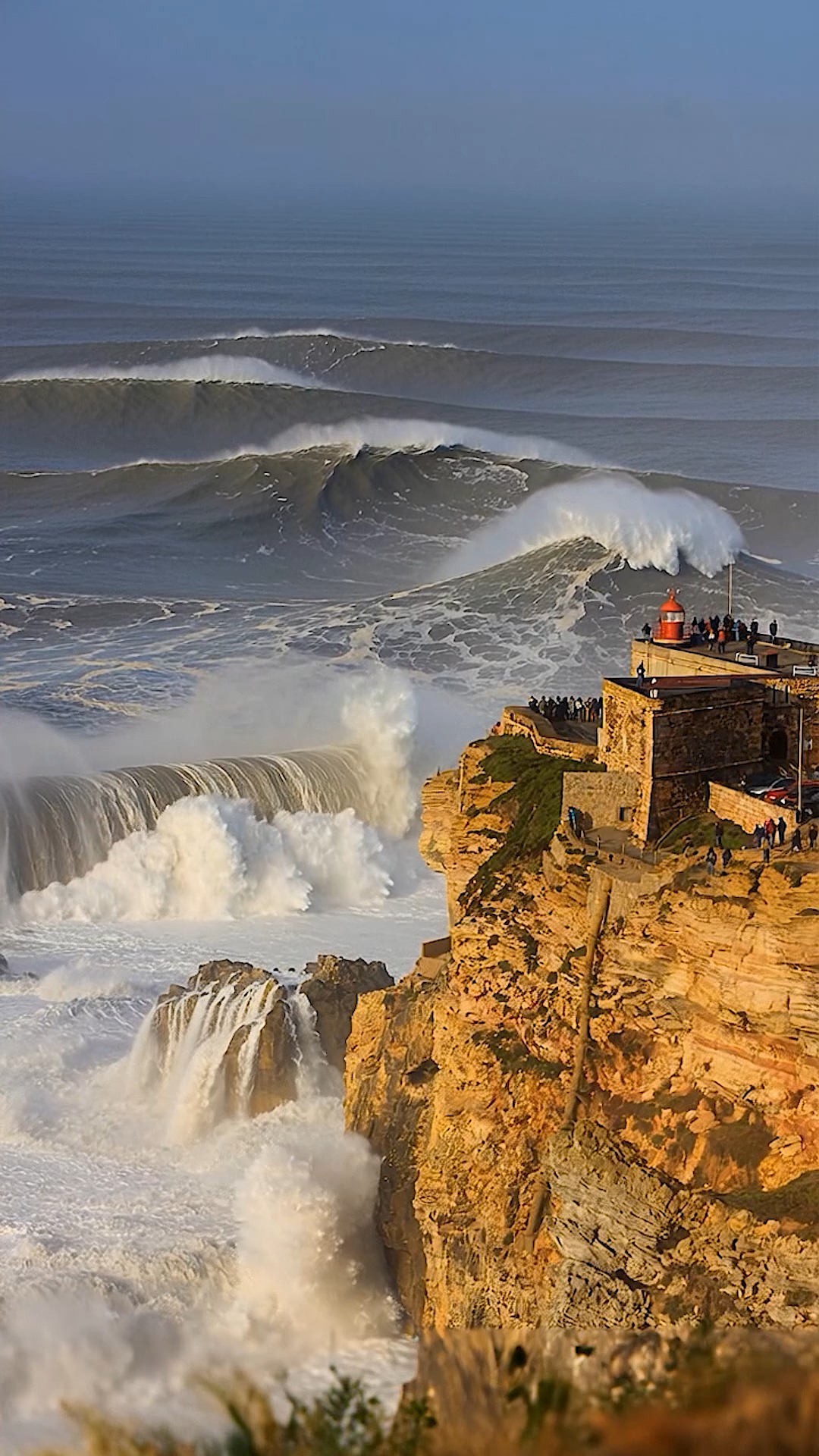 Giant Nazaré Swells Crash Beside Historic Fort