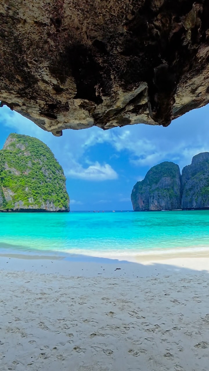 Two Islands With Turquoise Waters And Rock Formations