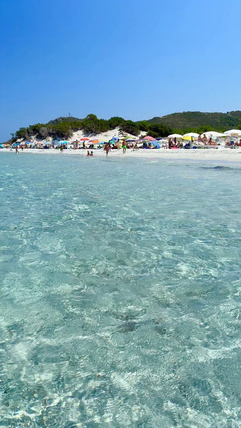 Capo Comino's Pristine Beach and Turquoise Waters