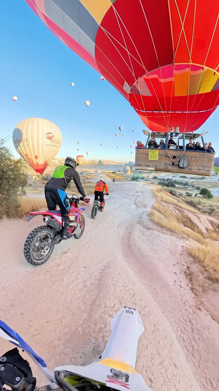 Hot Air Balloons Float Over Dirt Bike Ride