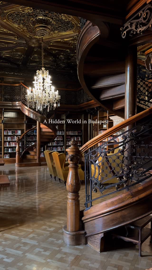 Budapest Library's Grand Chandelier and Spiral Staircase