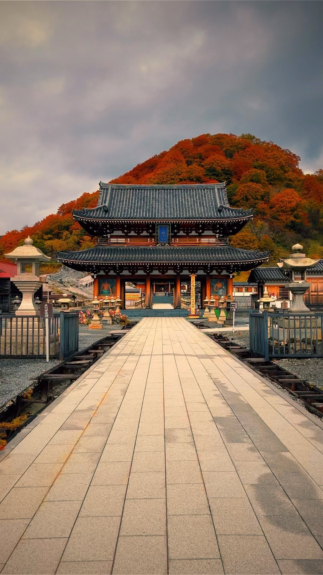 Sacred Mountain And Temple Amidst Autumn Foliage